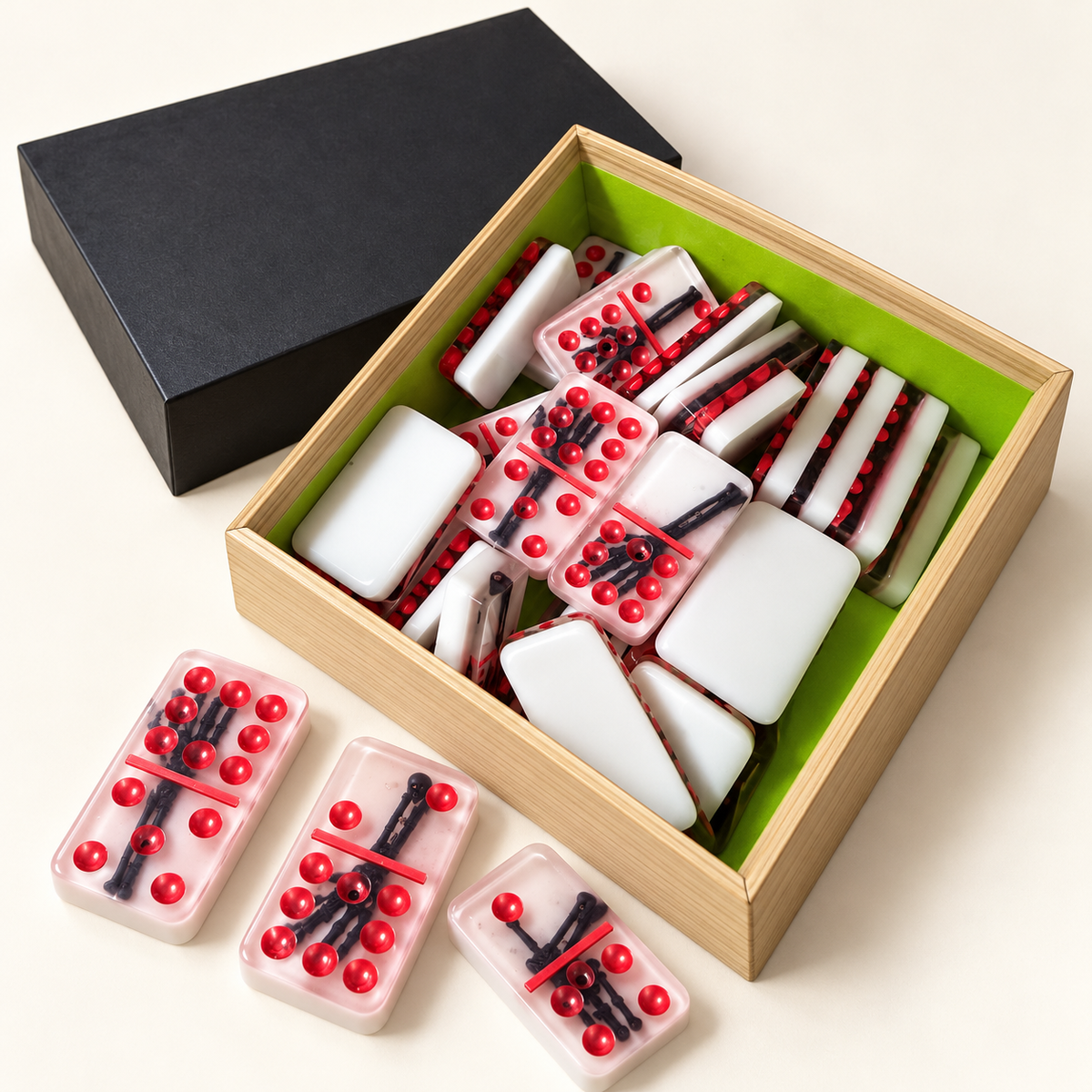 White skeleton hand resin dominoes with red pips in a gift box